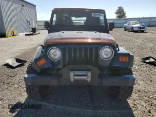 2003 Jeep Wrangler Sport with VIN 1J4FA49S63P361676, listed as a Copart auction lot 59054905 with 123,184 mi miles and Salvage title. Bid and sale history available at DreamBid. Image 5.