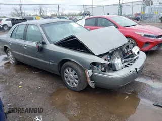 2003 Mercury Grand Marquis LS Premium with VIN 2MEFM75W33X655360, listed as a IAAI auction lot 41922734 with 86,059 mi miles and . Bid and sale history available at DreamBid. Image 1.