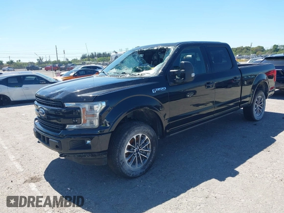 2018 Ford F-150 XL with VIN 1FTFW1EG9JFC63669, listed as a IAAI auction lot 41748012 with 143,584 mi miles. Bid and sale history available at carsss.com. Image 2.