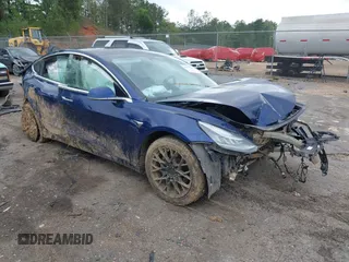 2019 Tesla Model 3 Mid Range z VIN 5YJ3E1EAXKF332974, wystawiony jako IAAI lot #41921722 z przebiegiem Nie podano mil oraz . Historia ofert i sprzedaży dostępna na DreamBid. Obrazek 1.