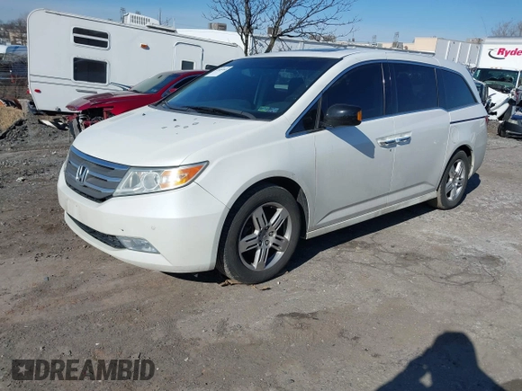2012 Honda Odyssey Touring with VIN 5FNRL5H96CB010696, listed as a IAAI auction lot 41605868 with 109,411 mi miles and . Bid and sale history available at carsss.com. Image 17.