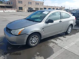 2008 Ford Focus SE with VIN 1FAHP33NX8W135881, listed as a IAAI auction lot 41668949 with 160,261 mi miles. Bid and sale history available at carsss.com. Image 2.