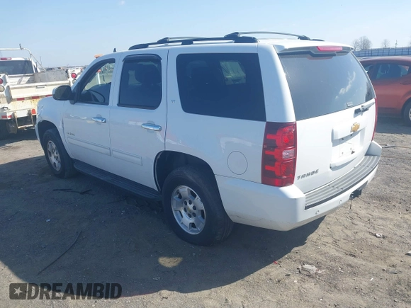 2014 Chevrolet Tahoe LT with VIN 1GNSCBE06ER233105, listed as a IAAI auction lot 41753190 with 161,056 mi miles and . Bid and sale history available at DreamBid. Image 3.