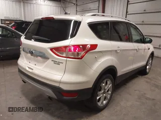 2016 Ford Escape Titanium with VIN 1FMCU9J99GUA61848, listed as a IAAI auction lot 42300324 with 51,692 mi miles and . Bid and sale history available at DreamBid. Image 4.