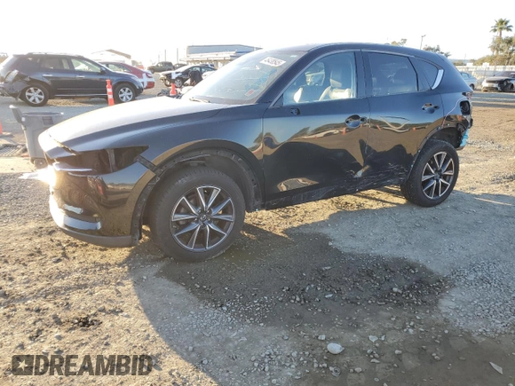 2018 Mazda CX-5 Grand Touring with VIN JM3KFBDMXJ0318474, listed as a Copart auction lot 46438545 with 58,702 mi miles and Salvage Title. Bid and sale history available at DreamBid. Image 1.