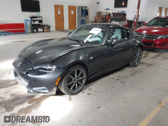 2021 Mazda MX-5 Miata Grand Touring with VIN JM1NDAM73M0451484, listed as a IAAI auction lot 41485044 with 11,328 mi miles and . Bid and sale history available at DreamBid. Image 17.