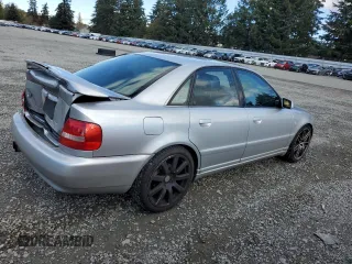 2000 Audi S4 z VIN WAUDD68D7YA179687, wystawiony jako Copart lot #77201694 z przebiegiem 165 118 mil mil oraz Szkody całkowita. Historia ofert i sprzedaży dostępna na DreamBid. Obrazek 3.