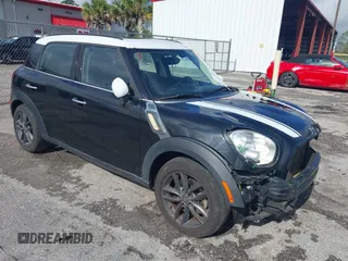 2013 MINI Countryman S z VIN WMWZC3C5XDWP24270, wystawiony jako IAAI lot #42232550 z przebiegiem 95 512 mil mil oraz . Historia ofert i sprzedaży dostępna na DreamBid. Obrazek 1.