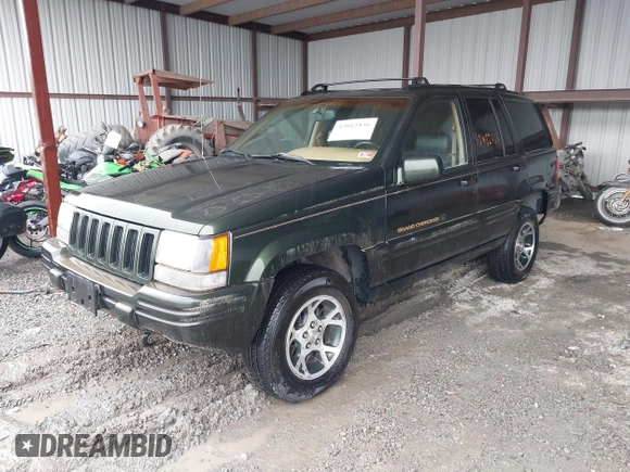 1997 Jeep Grand Cherokee Limited with VIN 1J4GZ78Y5VC723429, listed as a IAAI auction lot 42012836 with 231,126 mi miles. Bid and sale history available at carsss.com. Image 17.