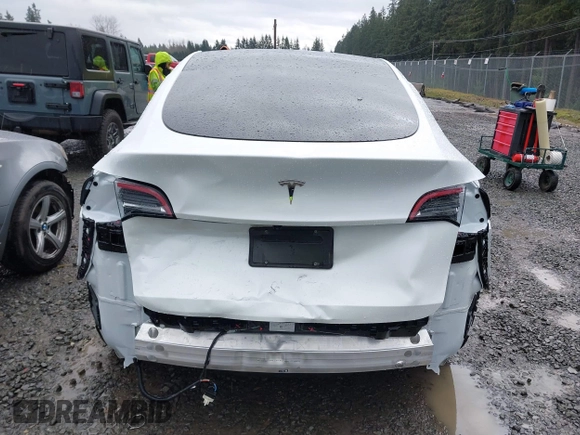 2025 Tesla Model Y Long Range with VIN 7SAYGDEDXSF248734, listed as a IAAI auction lot 41719195 with 5,876 mi miles and . Bid and sale history available at DreamBid. Image 16.