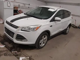 2013 Ford Escape SE with VIN 1FMCU0GX5DUA74237, listed as a IAAI auction lot 42447048 with 140,732 mi miles and . Bid and sale history available at DreamBid. Image 2.
