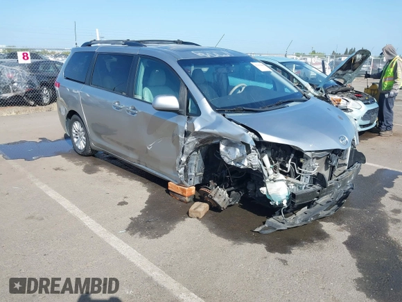 2011 Toyota Sienna XLE AAS with VIN 5TDYK3DC8BS156127, listed as a IAAI auction lot 42103980 with 129,851 mi miles. Bid and sale history available at carsss.com. Image 1.