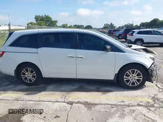 2012 Honda Odyssey EX-L z VIN 5FNRL5H61CB032353, wystawiony jako IAAI lot #42471691 z przebiegiem 186 257 mil mil oraz . Historia ofert i sprzedaży dostępna na DreamBid. Obrazek 13.