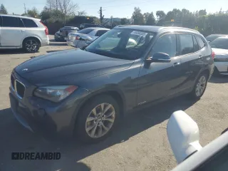 2013 BMW X1 xDrive28i with VIN WBAVL1C52DVR91167, listed as a Copart auction lot 49090395 with 74,323 mi miles and Clean Title. Bid and sale history available at carsss.com. Image 1.