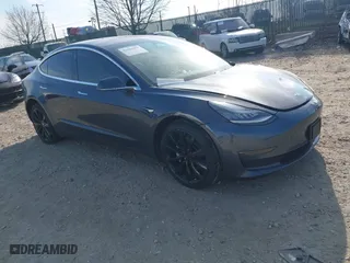 2019 Tesla Model 3 Long Range with VIN 5YJ3E1EB4KF195538, listed as a IAAI auction lot 41902467 with 122,117 mi miles. Bid and sale history available at carsss.com. Image 1.