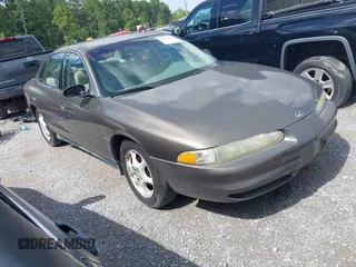 1999 Oldsmobile Intrigue GX z VIN 1G3WH52H0XF377325, wystawiony jako IAAI lot #42479174 z przebiegiem 108 836 mil mil oraz . Historia ofert i sprzedaży dostępna na DreamBid. Obrazek 1.