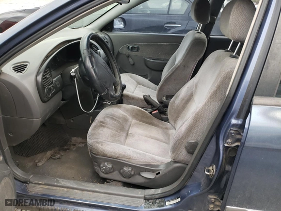 2003 Kia Spectra with VIN KNAFB121135283707, listed as a Copart auction lot 71500884 with 165,245 mi miles and Salvage Title. Bid and sale history available at carsss.com. Image 7.