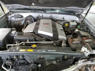 1999 Toyota Land Cruiser with VIN JT3HT05J1X0038590, listed as a Copart auction lot 87452404 with 232,244 mi miles and Salvage Title. Bid and sale history available at carsss.com. Image 12.
