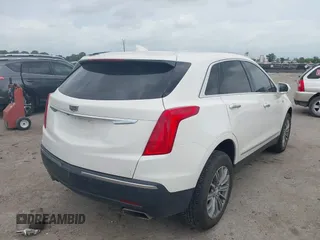 2019 Cadillac XT5 Luxury FWD z VIN 1GYKNCRSXKZ286643, wystawiony jako IAAI lot #42129213 z przebiegiem 87 091 mil mil oraz . Historia ofert i sprzedaży dostępna na DreamBid. Obrazek 4.