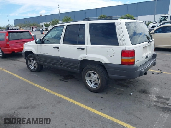 1996 Jeep Grand Cherokee Laredo with VIN 1J4FX58S5TC388512, listed as a IAAI auction lot 42803796 with 147,732 mi miles and . Bid and sale history available at DreamBid. Image 3.