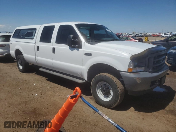 2004 Ford F-250 XL with VIN 1FTNW21L94EC37720, listed as a Copart auction lot 55412095 with 145,255 mi miles and Salvage title. Bid and sale history available at DreamBid. Image 4.