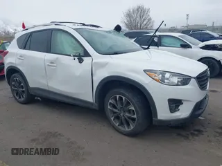 2016 Mazda CX-5 Grand Touring z VIN JM3KE2DY8G0885006, wystawiony jako IAAI lot #41615873 z przebiegiem 118 890 mil mil oraz . Historia ofert i sprzedaży dostępna na DreamBid. Obrazek 1.