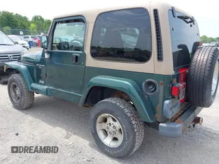 1999 Jeep Wrangler Sahara z VIN 1J4FY49S7XP442719, wystawiony jako IAAI lot #42506510 z przebiegiem 188 175 mil mil oraz . Historia ofert i sprzedaży dostępna na DreamBid. Obrazek 3.