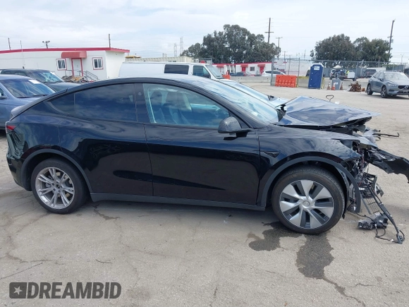 2023 Tesla Model Y Long Range z VIN 7SAYGDEE2PF863200, wystawiony jako IAAI lot #41805168 z przebiegiem 25 480 mil mil oraz . Historia ofert i sprzedaży dostępna na DreamBid. Obrazek 14.