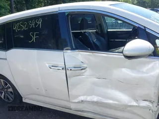 2014 Honda Odyssey Touring with VIN 5FNRL5H94EB071788, listed as a IAAI auction lot 42523959 with 244,734 mi miles and . Bid and sale history available at DreamBid. Image 13.