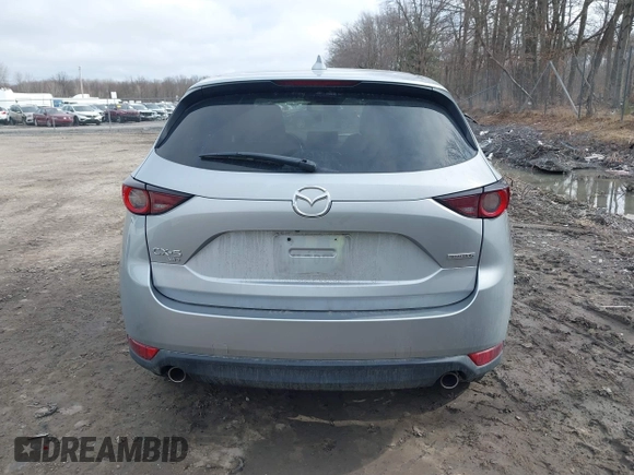2021 Mazda CX-5 Touring with VIN JM3KFBCM9M1329806, listed as a IAAI auction lot 41825123 with 59,300 mi miles. Bid and sale history available at carsss.com. Image 16.