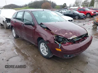 2007 Ford Focus S z VIN 1FAFP37N57W217890, wystawiony jako IAAI lot #41951131 z przebiegiem 94 047 mil mil oraz . Historia ofert i sprzedaży dostępna na DreamBid. Obrazek 1.