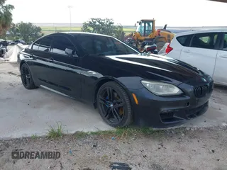 2014 BMW 6 Series 650i z VIN WBA6B2C57ED129681, wystawiony jako IAAI lot #42517803 z przebiegiem 208 644 mil mil oraz . Historia ofert i sprzedaży dostępna na DreamBid. Obrazek 1.