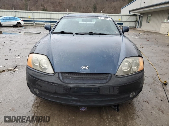 2003 Hyundai Tiburon GT z VIN KMHHN65F13U068658, wystawiony jako Copart lot #81799404 z przebiegiem 163 148 mil mil oraz Szkoda całkowita • Salvage title. Historia ofert i sprzedaży dostępna na DreamBid. Obrazek 5.