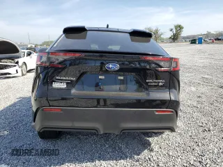 2024 Subaru Solterra Premium z VIN JTMABABA0RA063942, wystawiony jako Copart lot #53784865 z przebiegiem 9509 mil mil oraz Nie do naprawy. Historia ofert i sprzedaży dostępna na DreamBid. Obrazek 6.