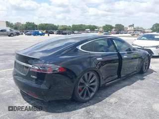 2017 Tesla Model S 100D with VIN 5YJSA1E47HF185734, listed as a IAAI auction lot 42076544 with 56,682 mi miles. Bid and sale history available at carsss.com. Image 4.