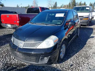 2009 Nissan Versa 1.8 SL with VIN 3N1BC13E59L406937, listed as a IAAI auction lot 41387158 with 149,234 mi miles. Bid and sale history available at carsss.com. Image 17.