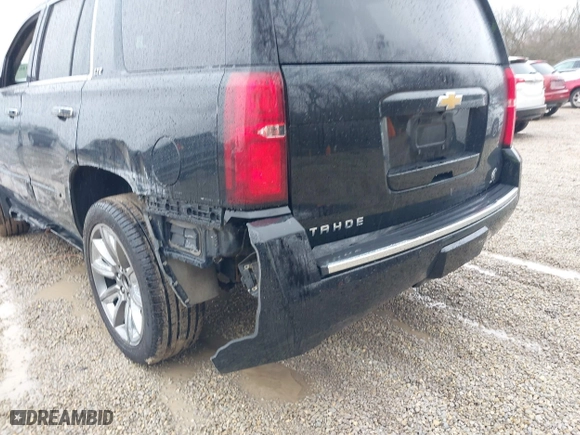 2016 Chevrolet Tahoe LTZ with VIN 1GNSKCKC2GR104305, listed as a IAAI auction lot 41697868 with 124,670 mi miles. Bid and sale history available at carsss.com. Image 18.