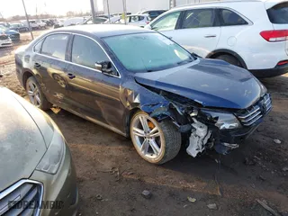 2015 Volkswagen Passat 2.0L TDI SE w/Sunroof with VIN 1VWBV7A34FC021031, listed as a IAAI auction lot 41601548 with 173,402 mi miles. Bid and sale history available at carsss.com. Image 1.