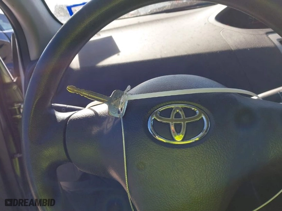 2012 Toyota Yaris with VIN JTDBT4K35CL038860, listed as a IAAI auction lot 41254384 with 161,536 mi miles. Bid and sale history available at carsss.com. Image 11.