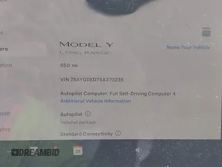2025 Tesla Model Y Long Range with VIN 7SAYGDED7SA373235, listed as a IAAI auction lot 42100950 with 650 mi miles and . Bid and sale history available at DreamBid. Image 7.