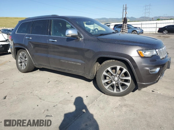 2017 Jeep Grand Cherokee Overland with VIN 1C4RJFCG9HC601806, listed as a Copart auction lot 61786275 with 122,898 mi miles and Salvage title. Bid and sale history available at DreamBid. Image 4.