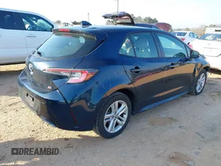 2021 Toyota Corolla Hatchback SE with VIN JTND4MBE9M3114388, listed as a IAAI auction lot 41796303 with 58,656 mi miles. Bid and sale history available at carsss.com. Image 4.