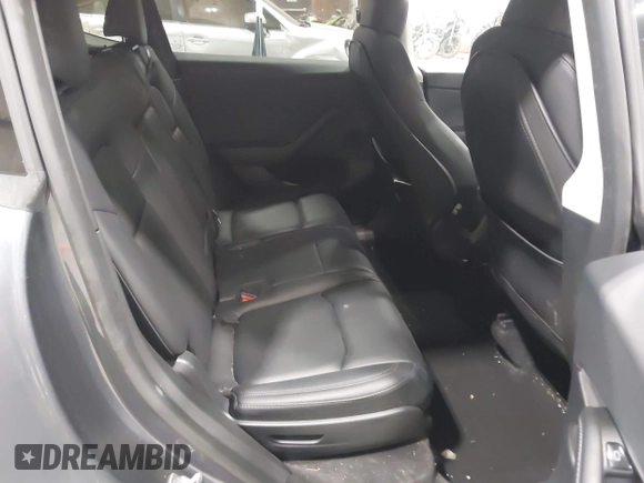 2023 Tesla Model Y Long Range with VIN 7SAYGAEE2PF755674, listed as a IAAI auction lot 41890025 with 24,783 mi miles and . Bid and sale history available at DreamBid. Image 8.