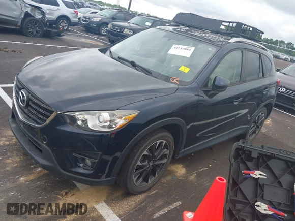 2016 Mazda CX-5 Grand Touring with VIN JM3KE2DYXG0890174, listed as a IAAI auction lot 42157884 with 141,873 mi miles. Bid and sale history available at carsss.com. Image 17.