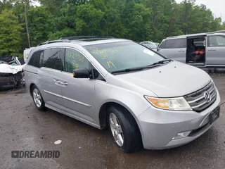 2011 Honda Odyssey Touring with VIN 5FNRL5H93BB030662, listed as a IAAI auction lot 42219767 with 231,026 mi miles and . Bid and sale history available at DreamBid. Image 1.