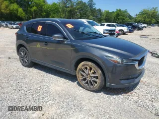 2018 Mazda CX-5 Grand Touring with VIN JM3KFADM9J0343621, listed as a Copart auction lot 52284475 with 129,776 mi miles and Salvage Title. Bid and sale history available at DreamBid. Image 4.