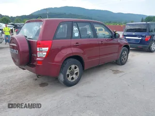 2008 Suzuki Grand Vitara w/Spare & Cargo Covers z VIN JS3TD941784101146, wystawiony jako IAAI lot #42546416 z przebiegiem 83 064 mil mil oraz . Historia ofert i sprzedaży dostępna na DreamBid. Obrazek 4.