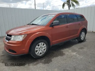 2014 Dodge Journey American Value with VIN 3C4PDCAB6ET284121, listed as a Copart auction lot 62101295 with 106,243 mi miles and Clean title. Bid and sale history available at DreamBid. Image 1.
