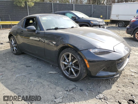 2021 Mazda MX-5 Miata Grand Touring with VIN JM1NDAM71M0451354, listed as a Copart auction lot 47756025 with 53,347 mi miles and Salvage title. Bid and sale history available at DreamBid. Image 4.