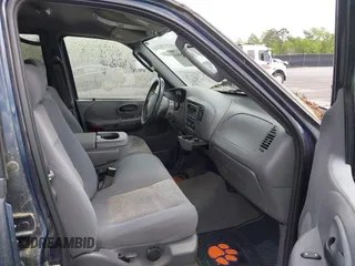 2003 Ford F-150 XLT with VIN 1FTRW076X3KC61967, listed as a IAAI auction lot 42016065 with 206,256 mi miles. Bid and sale history available at carsss.com. Image 5.